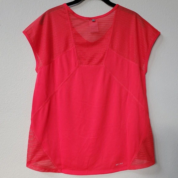NIKE Dri-Fit Workout T with Mesh Paneling in Melon Red. - Picture 2 of 8